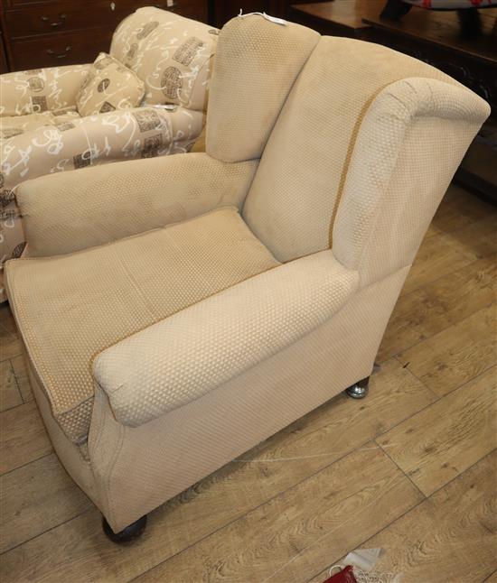 An early 20th century upholstered armchair